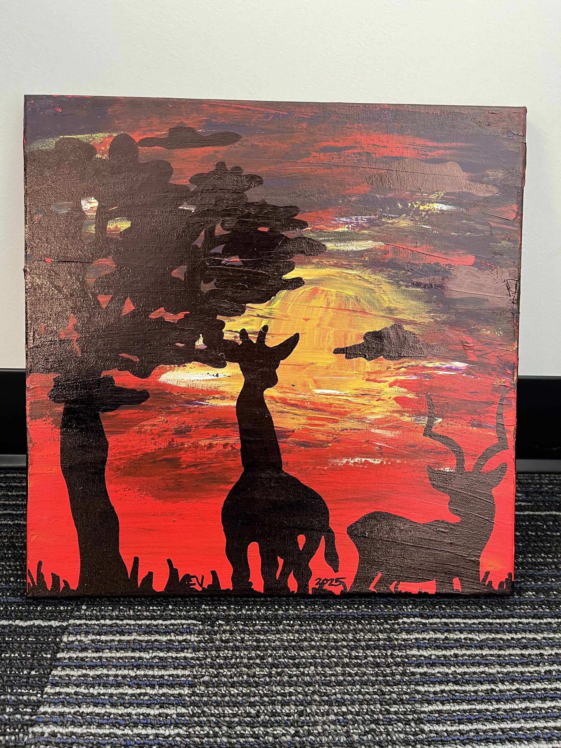 This was the original painting. It is an acrylic painting. It has a tree on the left hand side of the canvas. Standing next to it is an extremely stubby, short giraffe. next to the giraffe is an antelope. behind them is a sunset. I didn't like how it turned out so i painted over it, witch is what you see in the first painting. Because the tree, antelope and giraffe where made using permanent marker, when I layered it with paint on top, even after painting it twice, the marker showed threw. I didn't enjoy that idea but kept going anyway. In the end it gives the illusion that there are things in the background.