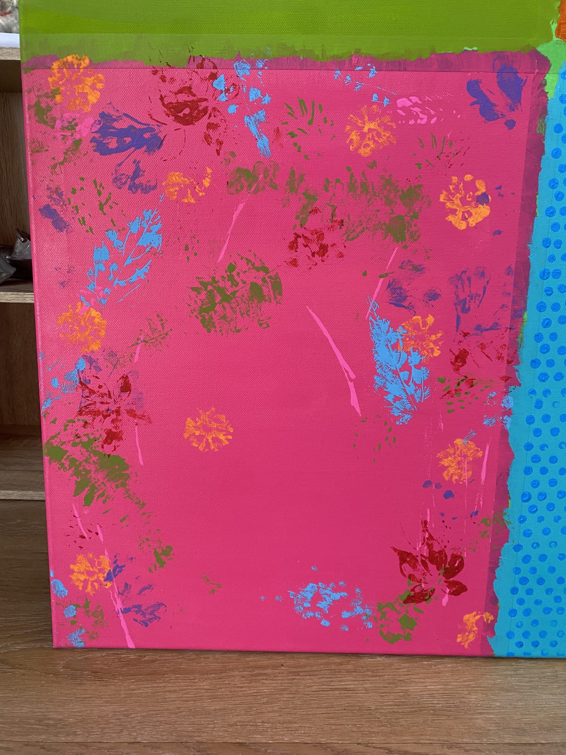 a beautiful set of blue, organse and green marks on the pink fuschia background on one of the sections