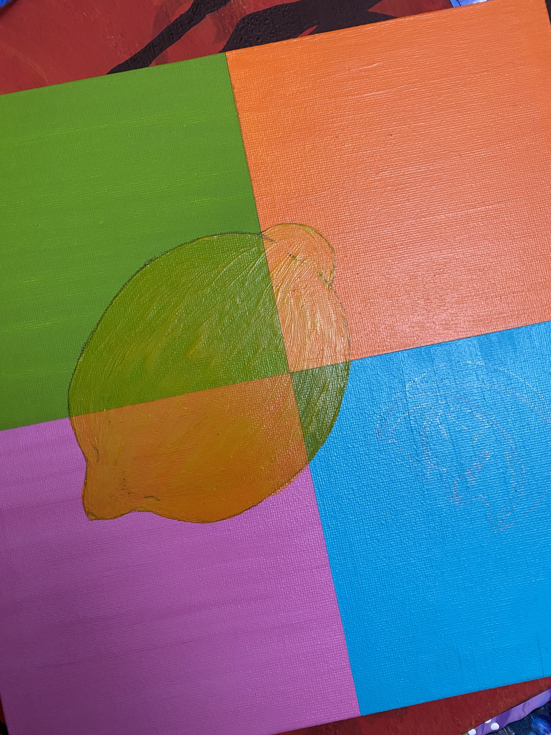 A rectangular canvas divided into four sections: the top left painted green, the bottom left painted pink, the top right painted orange, the bottom right painted blue. An outline of a lemon is drawn on top.