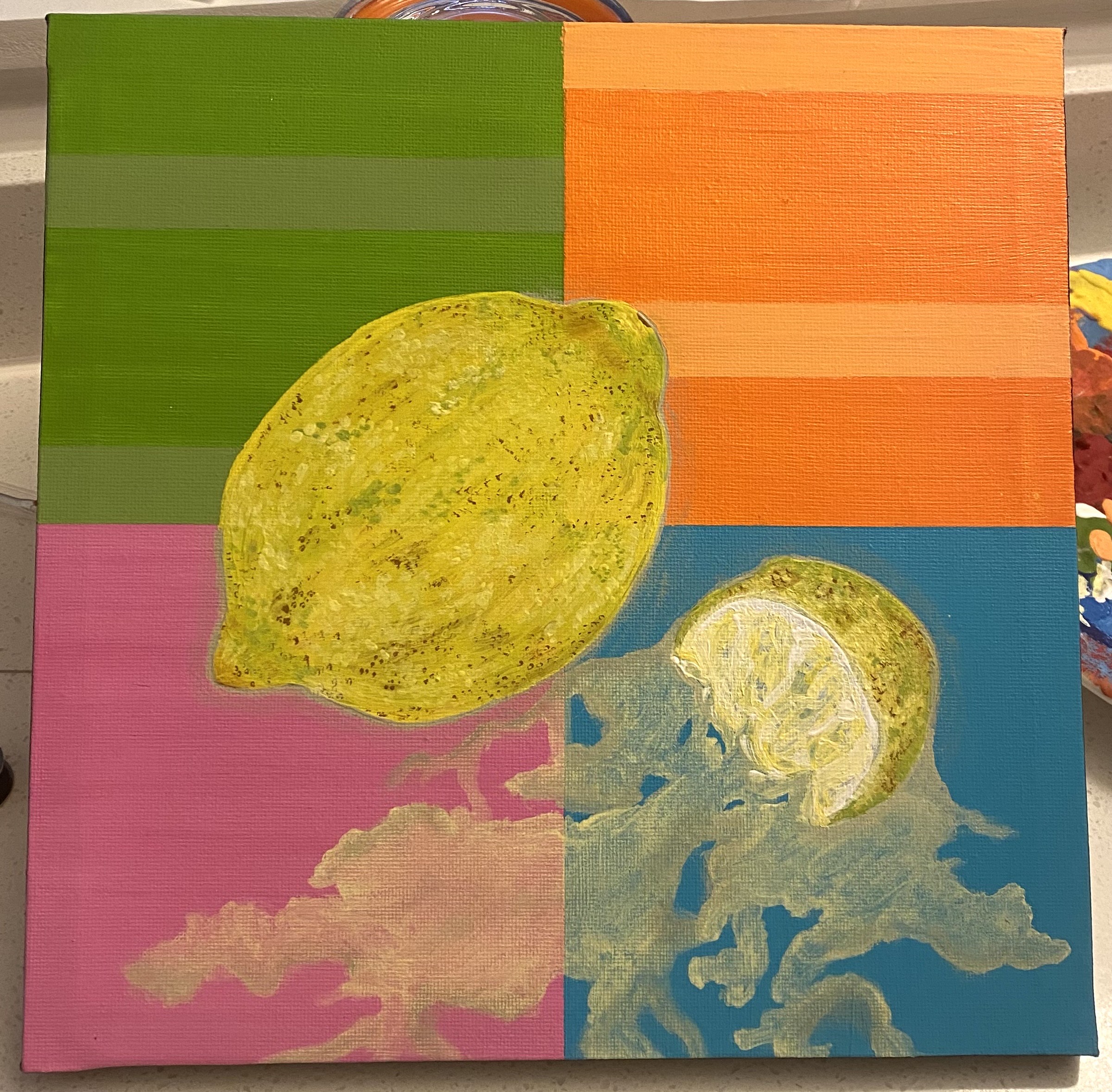 Green, Orange, Pink and Blue squares with a bright yellow lemon in the middle, a squeezed lemon slice next to it and lemon juice running off the page. The Green and Orange squares host lighter coloured lines alternating on both sides.