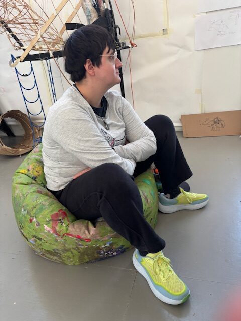 Lucy resting on her beanbag at Project Artworks