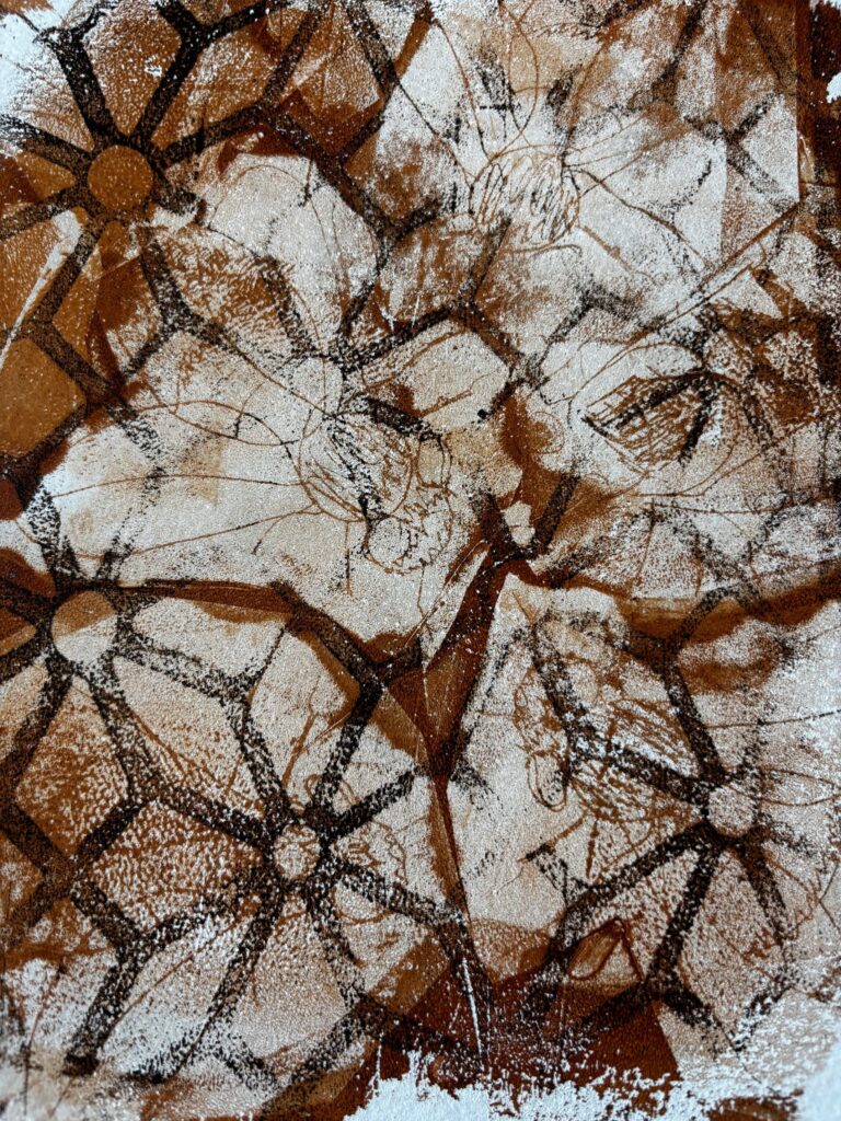 Bronze outlines almost like watery marks with black honeycomb pattern on a white background