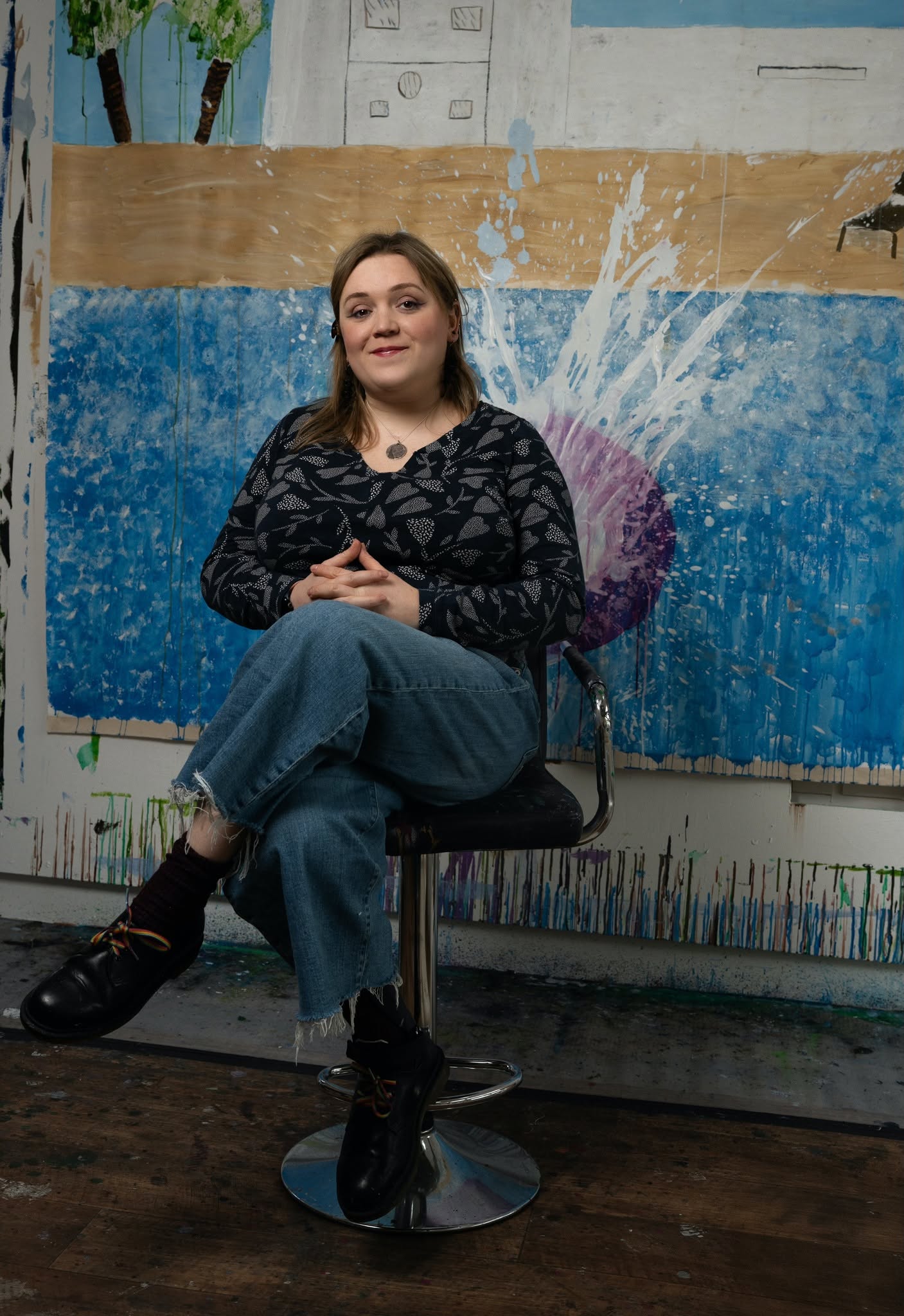 Portrait of me in front of my painting 'Grace and Johnny's Biggest Splash' inspired by David Hockney.