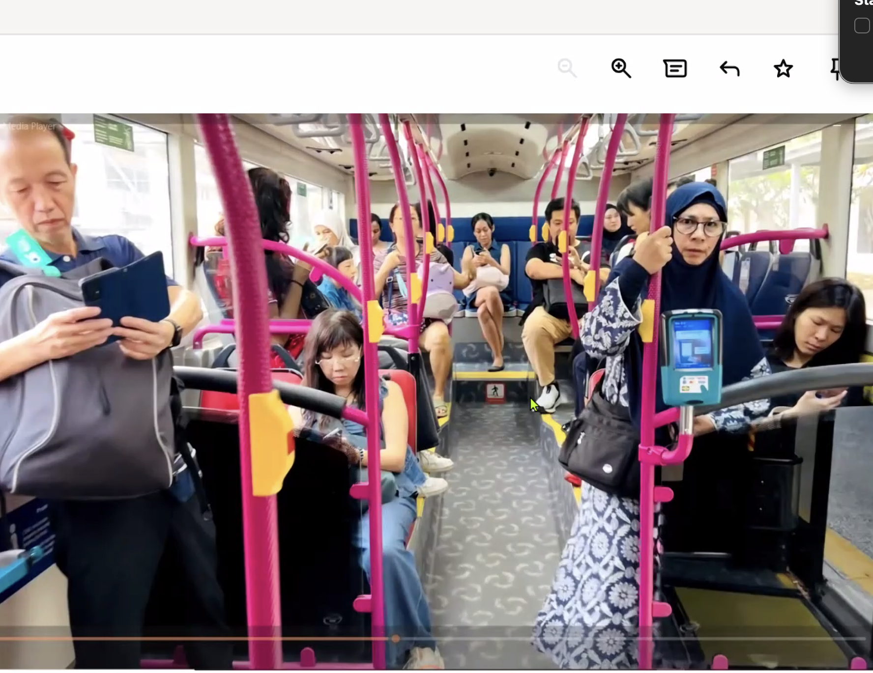 A vibrant scene o fmay people all on their phones, many looking worried, that Abraham took in Singapore inside the bus. What might Thompson make of it?