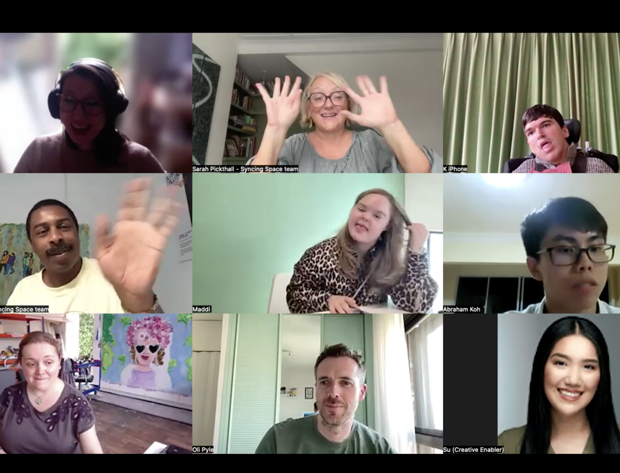A still image from our first Zoom call with people waving at the end of the sesssion