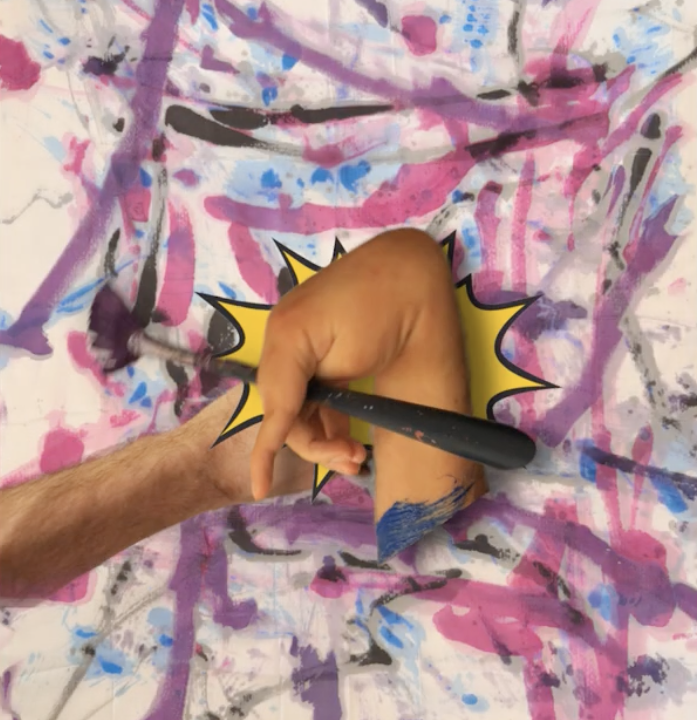 Mixed media artwork featuring a hand holding a paintbrush and another arm reaching towards it, against a colourful abstract background of pink, purple and blue marks, with a yellow comic book style starburst behind the hands.