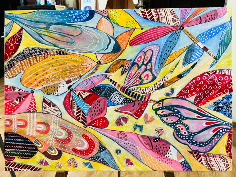 Completed abstract mixed media artwork featuring colourful butterfly wings and flowing organic shapes. Intricate geometric patterns, dots, stripes and delicate linework decorate overlapping forms in vibrant shades of blue, pink, yellow, orange, red and turquoise, set against a pale yellow and blue background.